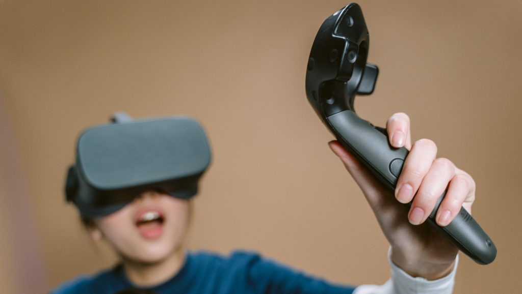 A woman playing a virtual reality game